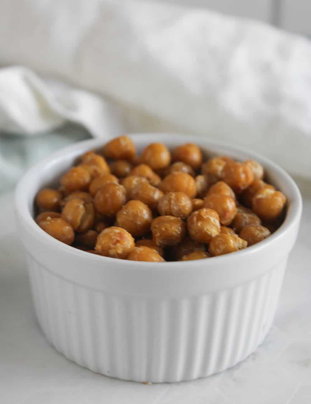 a picture of chickpeas in a small white bowl