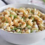 a close up of macaroni salad in a bowl