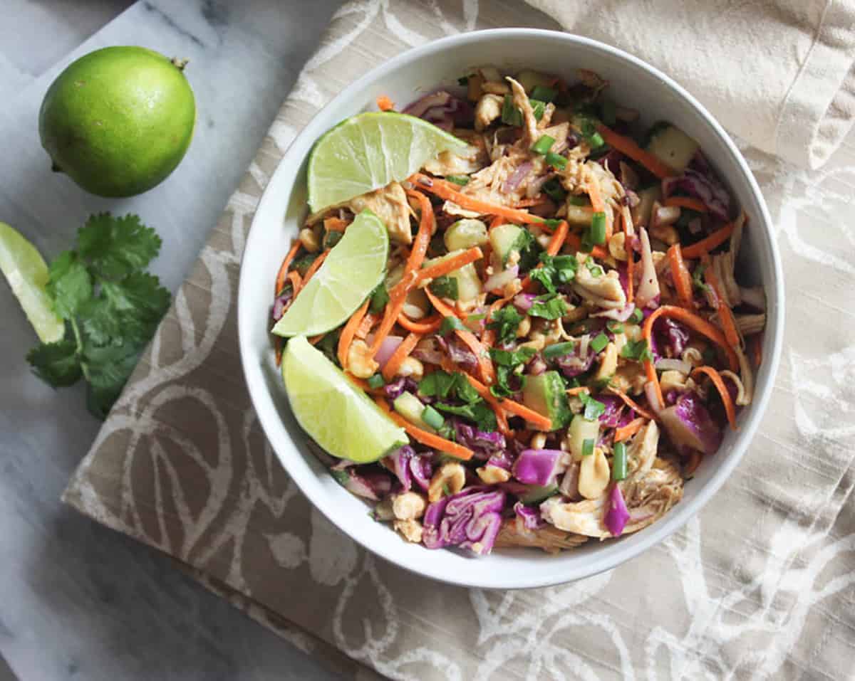 an overhead shot of thai chicken salad in a bowl
