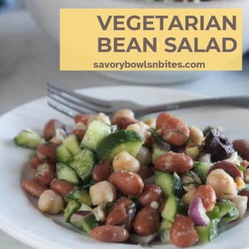 a picture of bean salad on white plate
