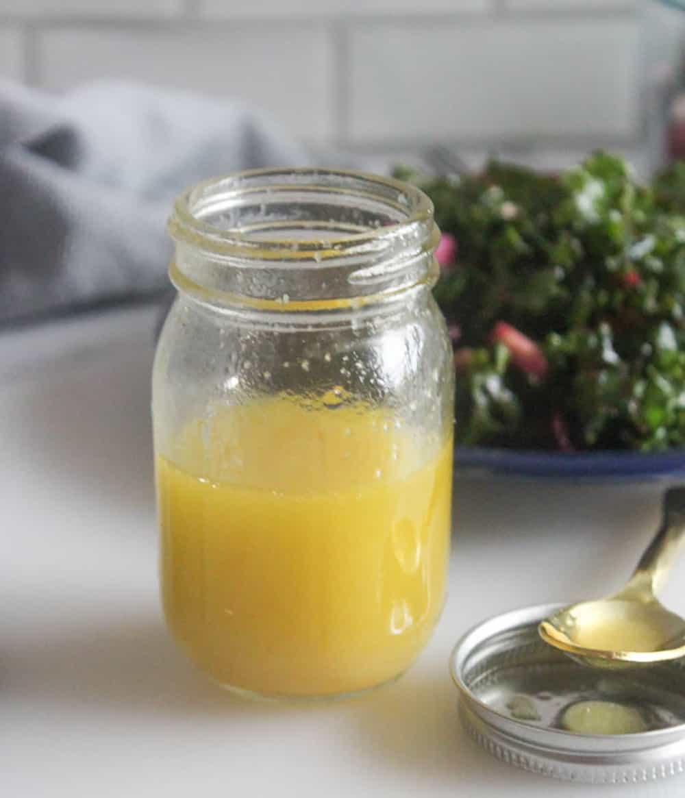 a close up of the dressing with a spoon