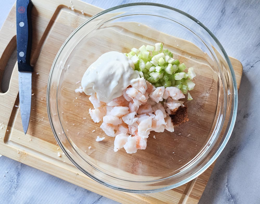 Shows process step 2, all of the ingredients are in a glass bowl not combined